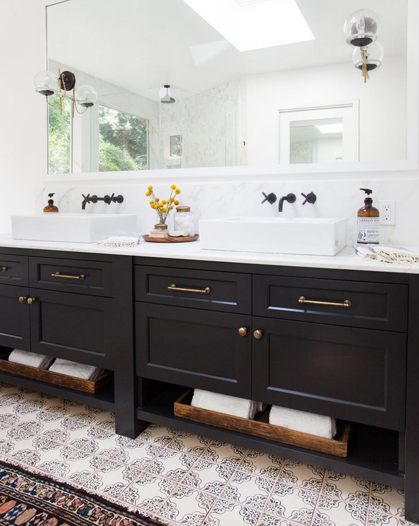 Bathroom Freestanding Double Vanity. Bathroom with freestanding navy double sink vanity topped with white counter and wall mounted faucets. Bathroom freestanding vanity and Cement tiles flooring. #Bathroom #FreestandingVanity #Doublevanity #cementtiles #bathroomcementtiles #wallmountedfaucet Amber Interiors