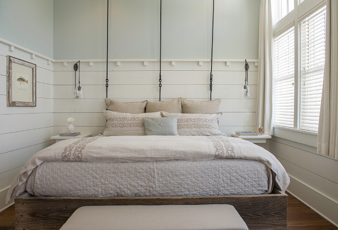 This custom bed features reclaimed wood base and wrought iron "headboard". #custombed #bed #reclaimedwoodbed #wroughtironbed Interiors by Courtney Dickey and T.S. Adams Studio.