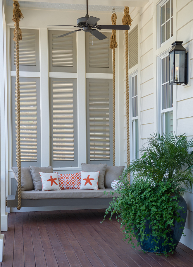 Bed swing paint color Benjamin Moore Briarwood. Porch with bed swing. Gray swing painted in Benjamin Moore Briarwood. #BenjaminMooreBriarwood Interiors by Courtney Dickey and T.S. Adams Studio.