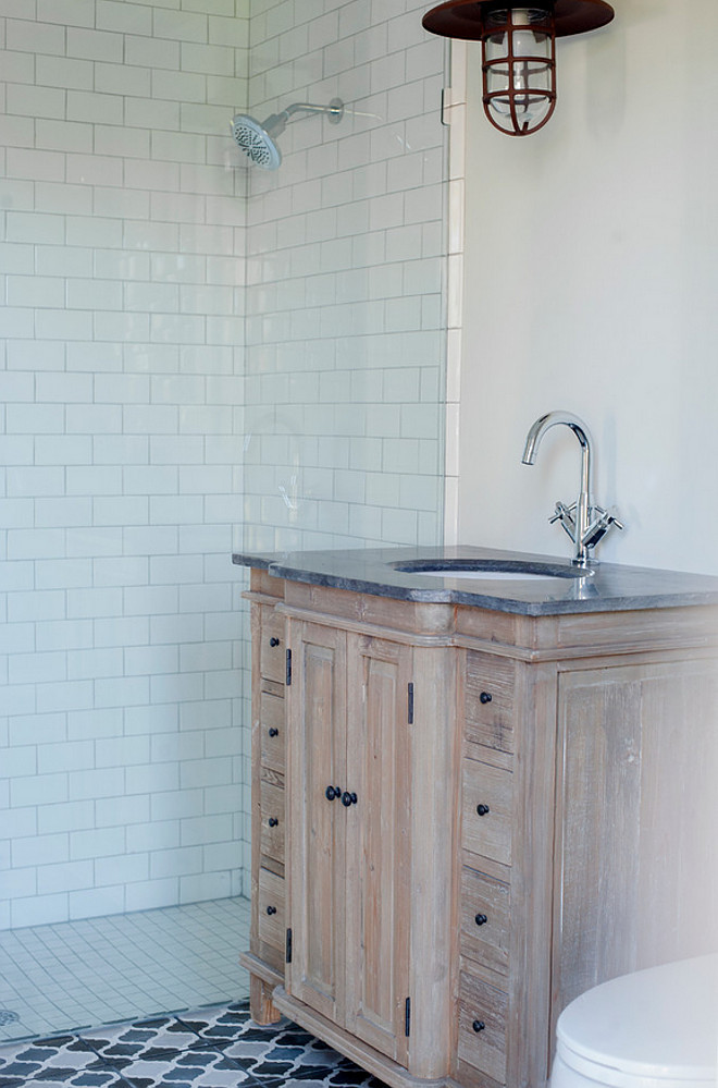 Reclaimed white oak wood bathroom cabinet. Bathroom features reclaimed white oak cabinet with whitewash and cement floor tiles. #bathroom #whiteoak #whitewash #cabinet #reclaimedwood #cementtiles Heritage Homes of Jacksonville