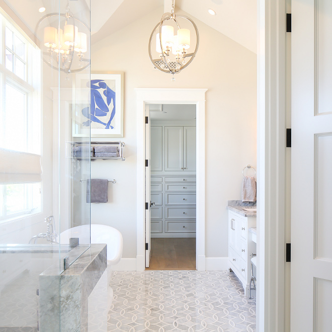 Bathroom floor tiles. The floor tiles are New Ravenna Mosaics Carrara with Thassos Tile in a Zazen Pattern. #bathroom #floortiles Patterson Custom Homes. Interiors by Trish Steele, Churchill Design. 