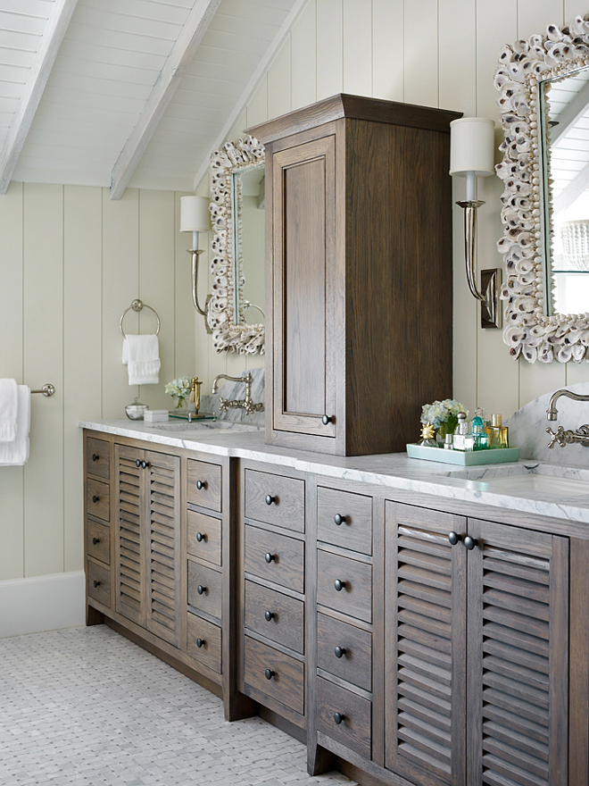 Reclaimed white oak cabinets with marble countertop. This bathroom features Reclaimed white oak cabinets with marble countertop and shell mirrors. #Reclaimedwhiteoak #whiteoakcabinets #marblecountertop #whiteoakcabinetmarblecountertop #ShellMirror T.S. Adams Studio, Architects 