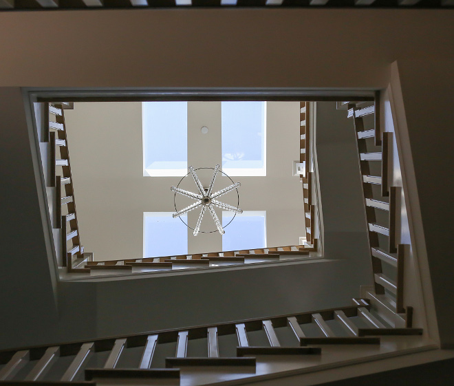 Skylight. The staircase feature skylights to bring some natural light in. Isn't it a smart and beautiful idea? #Skylight #skylights Patterson Custom Homes. Interiors by Trish Steele, Churchill Design.