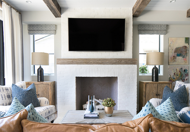 Brick Fireplace. White brick fireplace with reclaimed wood mantel. Painted White brick fireplace with reclaimed wood mantel. #Whitebrickfireplace #reclaimedwoodmantel Patterson Custom Homes