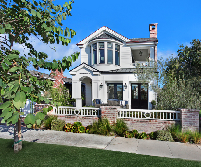 Home exterior. Home exterior Bay windows. Home exterior dutch door. Home exterior entry gate. Home exterior exposed brick. Home exterior fencing. Home exterior French door. Homes Patterson Custom Homes. Interiors by Trish Steele, Churchill Design.