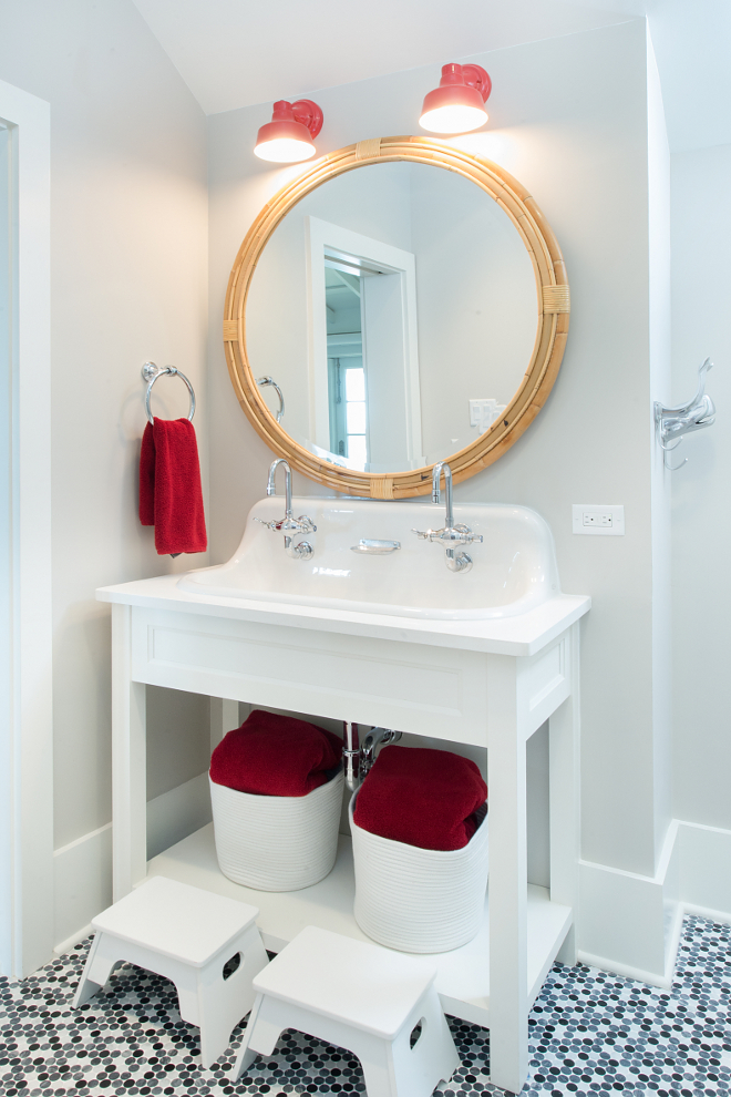 Farmhouse Bathroom. Farmhouse style kids bathroom. Kids bathroom with Wall Mounted Trough Sink by Kohler and open vanity. Farmhouse style kids bathroom ideas. #Farmhousebathroom #Farmhousestylekidsbathroom #kidsbathroom #WallMountedSink #WallMountedTroughSink #TroughSink Interiors by Courtney Dickey of TS Adams Studio.