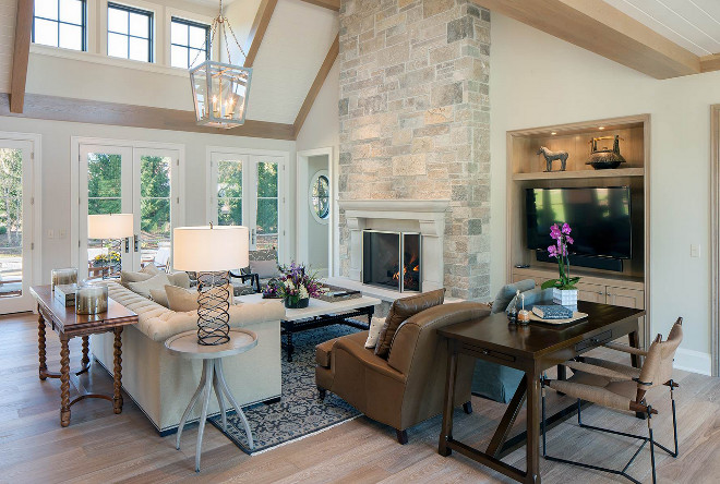 White Oak engineered wood floor. Living room with stone fireplace and White Oak engineered wood floor. #WhiteOakengineeredwoodfloor #WhiteOakwoodfloor Scott Christopher Homes