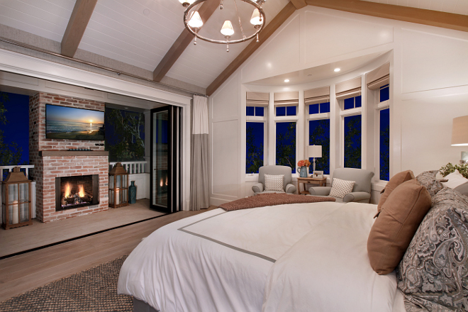 Bedroom Layout. The bedroom features patio folding doors to a private balcony with fireplace. #Bedroom #Bedroomlayout #BedroomBalcony #balcony Patterson Custom Homes. Interiors by Trish Steele, Churchill Design.