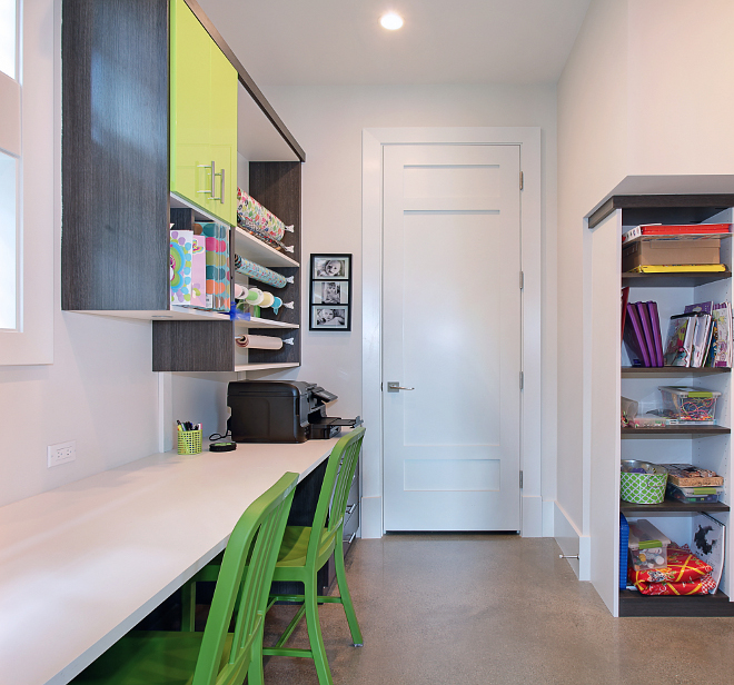 Craft Room. Kids computer station craft room. Fun craft room with cabinets by California Closets, concrete floor, wrapping station and lots of desk space for the children. #Kids #CraftRoom #computerstation #homeoffice
