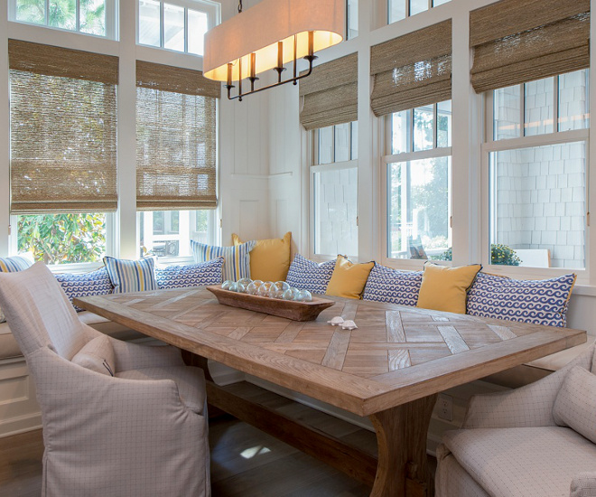 Lighting is from Arteriors - Beatty Chandelier. Long and narrow 4-light pendant in steel with dark bronze finish features light beige linen fabric oval shade. #breakastroom #lighting #banquette #Arteriors #BeattyChandelier Interiors by Courtney Dickey of TS Adams Studio.