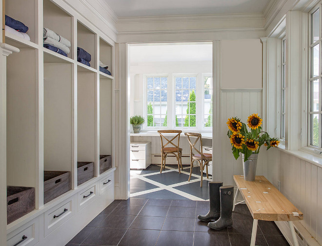 Farmhouse mudroom. Farmhouse mudroom with open cubbies, floor tiles and wainscoting walls. #Farmhouse #Mudroom #FarmhouseMudroom #Mudrooms Siemasko + Verbridge