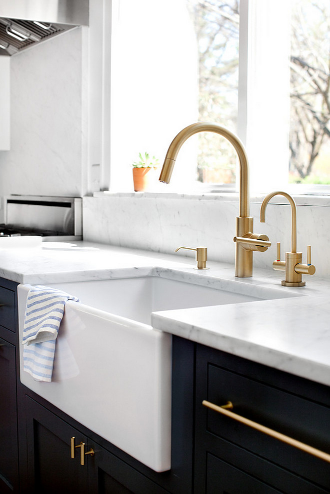 Farmhouse sink and faucet. Farmhouse sink faucet ideas. Kitchen farmhouse sink and faucet. The faucet, soap dispenser and hot water dispenser are the East Linear from Newport Brass. This is their Satin Brass finish. The farmhouse sink is a 30" Rohl. #kitchen #farmhousesink #apronsink #faucet #kitchenfaucet #sink Elizabeth Lawson Design