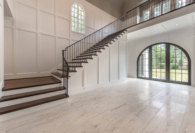 Foyer wainscoting and steel stair railing. Double height Foyer wainscoting and steel stair railing. #Foyer #wainscoting #steel #stairrailing Elizabeth Garrett Interiors.