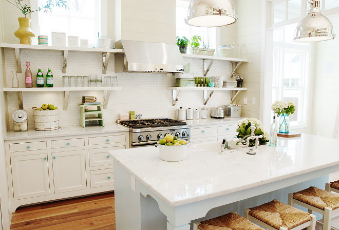 Kitchen open shelves. Open Shelves beside range hood. Open kitchen design with open shelves beside kitchen hood, ivory kitchen cabinets, turquoise blue hardware and mini-tile backsplash. The kitchen island features white carrara mable countertop and industrial yoke pendants. Kitchen Open Shelves beside range hood ideas. #kitchen #kitchenopenshelves #OpenShelves beside #hood Urban Grace Interiors