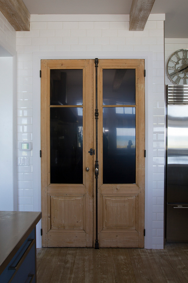 Kitchen pantry antique doors. The pantry features a 19th Century pair of French Doors w/ Cremones. #Kitchen #pantry #doors #antiquedoors #antiqueFrenchDoors Heritage Homes of Jacksonville and Villa Decor & Design