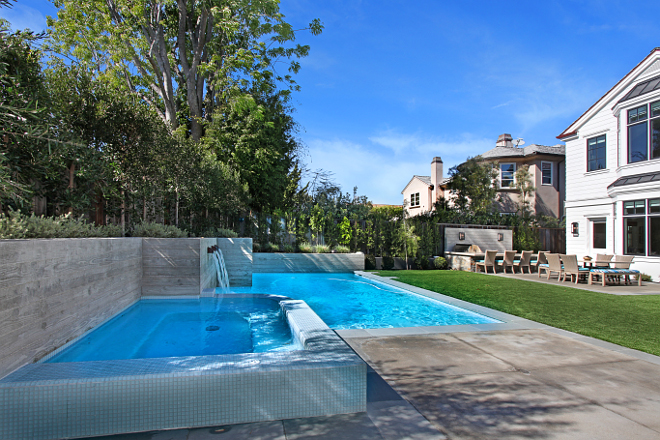 Pool and spa. The custom pool features stamped wood concrete walls. #pool #poolwall Patterson Custom Homes. Interiors by Trish Steele of Churchill Design. 