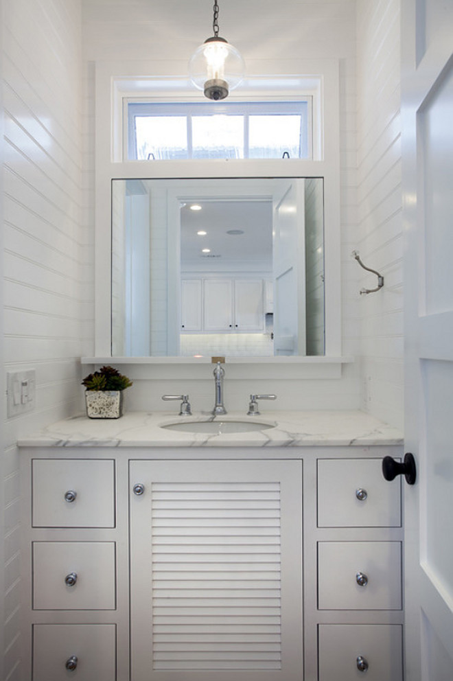 Small Powder room with floor to ceiling Tongue and Groove Wainscot Paneling. Tongue and Groove Wainscot Paneling Powder Room. #PowderRoom #TongueandGroove #WainscotPaneling #Wainscoting #paneling Graystone Custom Builders