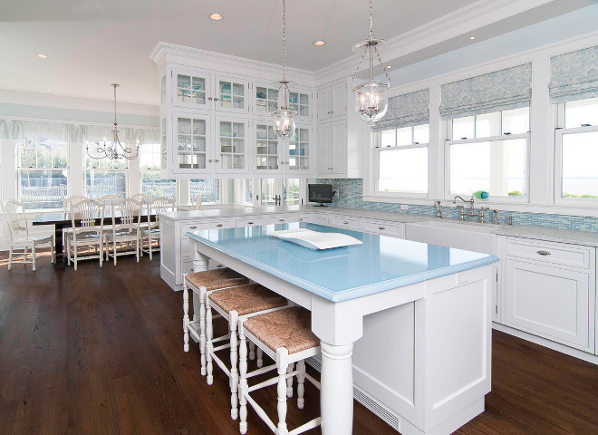 White and blue kitchen. White kitchen with light blue and turquoise accents. White, blue turquoise kitchen. The island is a material called Pyrolave and this was a custom color. #WhiteKitchen #bluekitchen #whiteandbluekitchen