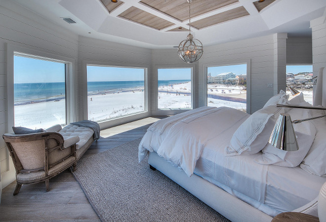 Beach house bedroom. All white bedroom with whitewashed hardwood floors, reclaimed wood ceiling, white shiplap wall paneling. #Bedroom