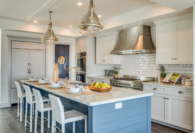 Beach style kitchen with port hole door. Beach style kitchen with blue island port hole door #Beachstyle #kitchen #blueisland #porthole #door Titan & Co.