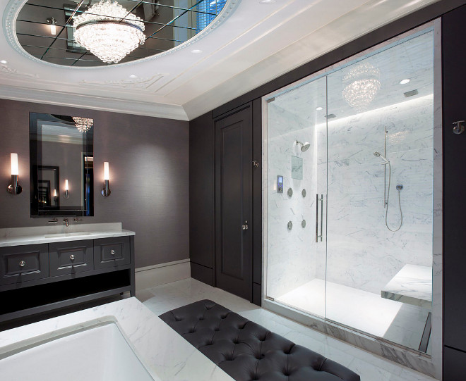 Charcoal Gray bathroom. Bathroom with charcoal gray walls and vanity with white marble shower, floors and countertop to contrast the dark gray walls.