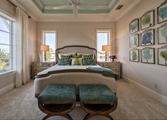 Coastal Bedroom Paint Color and decor. Coastal bedroom with coral art display and neutral wall paint colors. Ceiling is painted in Aloe by Sherwin Williams. #Coastal #Bedroom #Interiors