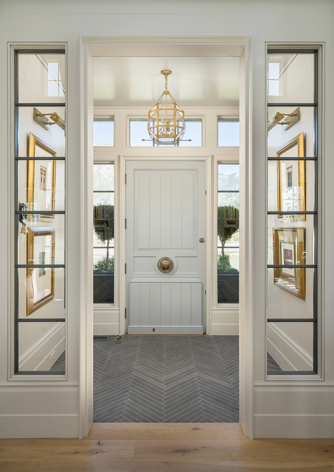 Foyer Flooring. Foyer with slate floor tile set in herringbone pattern. Foyer opens to living room with wide plank white oak floors. #Foyer #floors #Florring