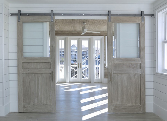 Glass and Wood Barn Door. Barn door with glass and whitewashed reclaimed wood. #BarnDoor #GlassbarnDoor Corestruction
