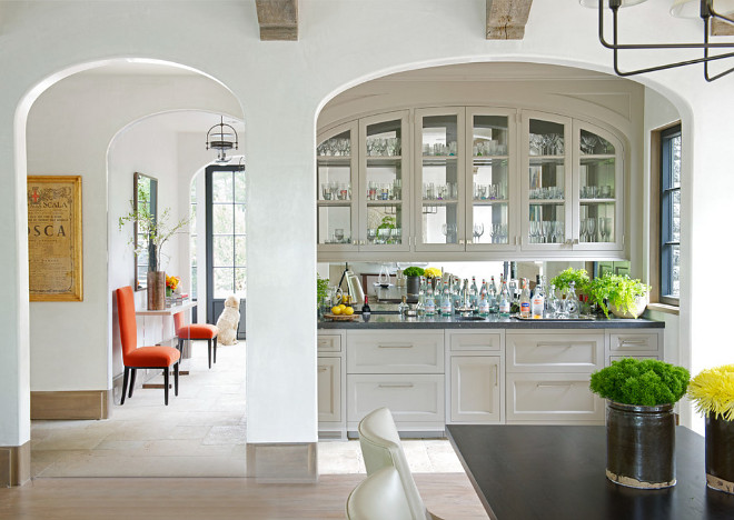 Kitchen Bar Cabinet. A wet bar cabinet is located in an arched nook just off the kitchen. #kitchen #Bar #beveragecabinet #wetbar Brooks and Falotico Associates, Inc.