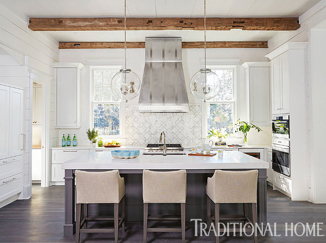 Kitchen Kitchen. A custom hood is centered on a waterjet-cut marble-and-glass tile backsplash. Glass orb pendants were custom-designed for above the island. Kitchen Pendants: “Vintage Glass Bubble Light” from South of Market. #kitchen #kitchens