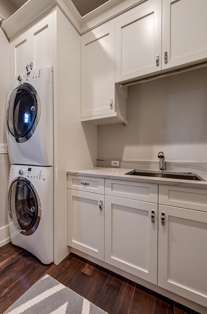 Laundry room white cabinets paint color. Laundry room white cabinet paint color is Sherwin Williams SW 6385 Dover White. Laundry Room gray wall paint color is Sherwin Williams Agreeable Gray