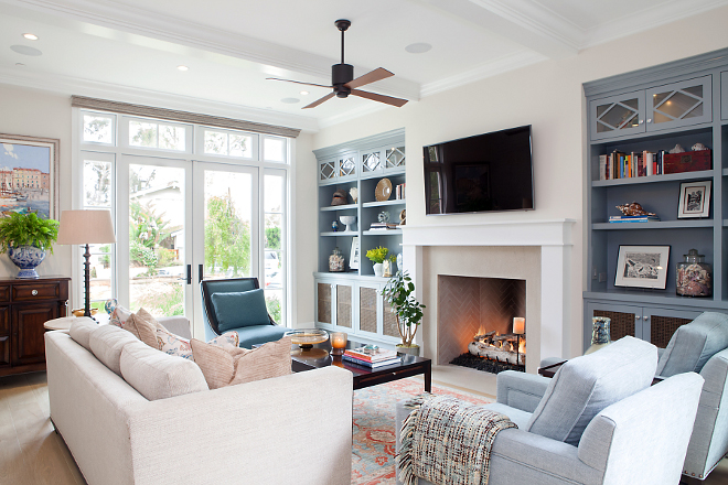 Living room paint color and decor. Living room paint colors and decor. Wall Color: Benjamin Moore 971 Olympic Mountains; Ceiling Fan: Period Arts Fan Company 52" Lapa Fan in Rubbed Bronze with Mahagony; Fireplace: 46" Isokern Fireplace, interior finished with 2"x9" grey brick layed in a herringbone pattern. #livingroom #paintcolor #decor #furniture Patterson Custom Homes 