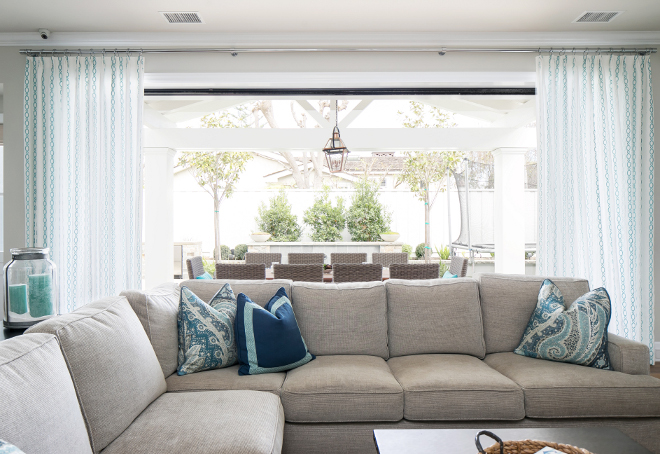 Living room with open doors to patio. Sectional is by Churchill Design. Churchill Design. 