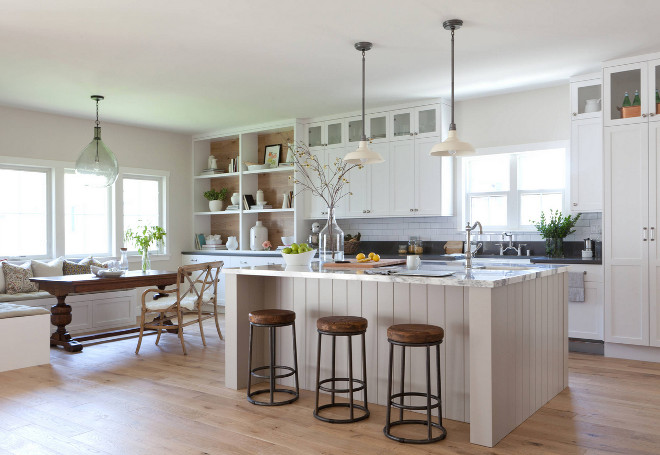 Modern Farmhouse Kitchen. The overall concept for the home is “Modern Farmhouse” and the designer's goal was to capture the charm, texture, and classic feel of a traditional farmhouse and incorporate that in to a more modern floor plan and design concept. In this modern farmhouse kitchen, the designer's most favorite element is the wood paneled hood. It took a little convincing on her part to get the homeowner to see her vision, but I think we all can agree that it was well worth it. Take a look and take notes on the designer's insights and tips on how to design a neutral modern farmhouse kitchen.