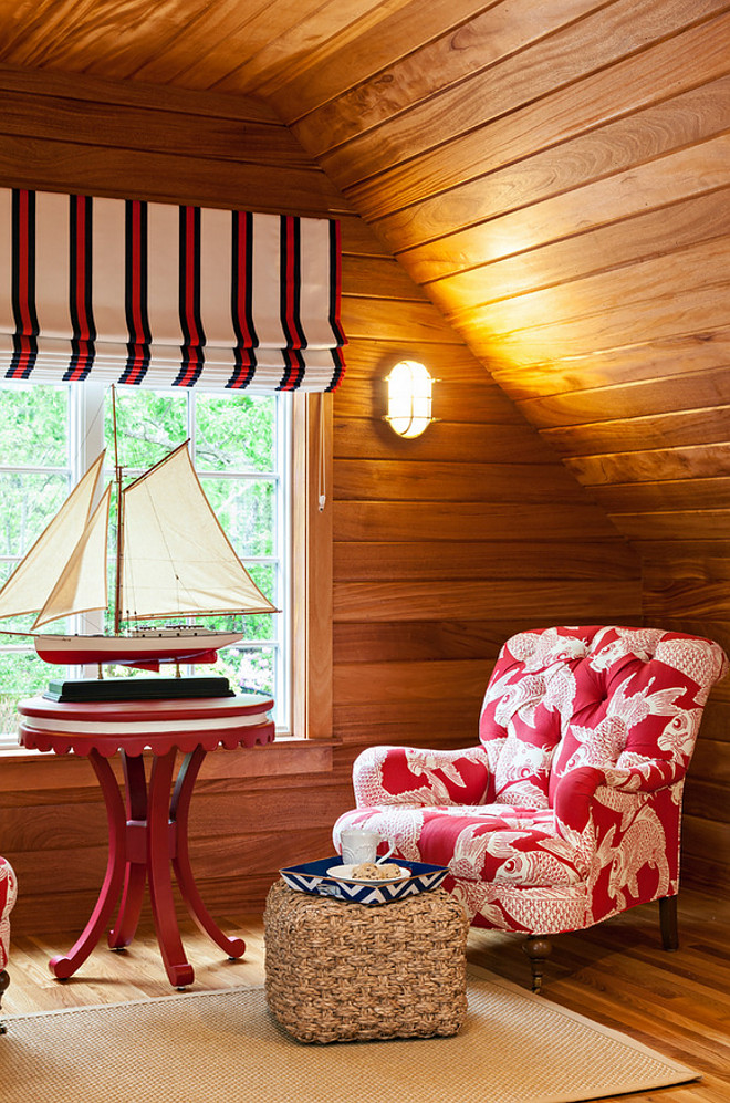Reading Nook. Nautical theme reading nook with shiplap plank walls. Reading Nook. Chair fabric: Manuel Canovas. Nautical sconces: Visual Comfort. Roman shade fabric: Ralph Lauren. Side table is from Oomph. #ReadingNook #NauticalTheme #Shiplap #plank #Shiplapwalls #plankwalls Violandi + Warner Interiors