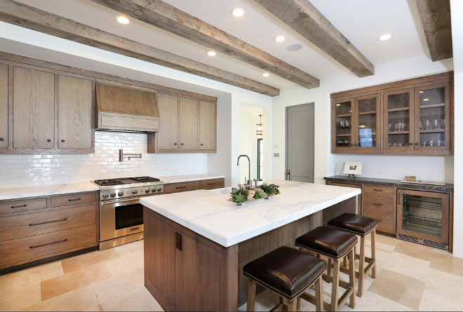 Rustic modern kitchen with white oak cabinets and reclaimed wood ceiling. #Rustic #Kitchen #ModernRusticInteriors #RusticInteriors #kitchens Blackband Design. Graystone Custom Builders