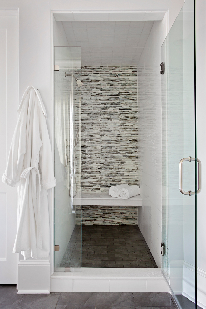 Shower Tiling. Shower Tiling ideas. This luxurious walk-in shower features linear mosaic glass tile shower surround and floating shower bench over dark gray tile floor. #Shower #Tiling #ShowerTiling #Tiles #tile TS Adams Studio Architects. Traci Rhoads Interiors.