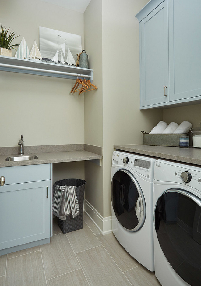 Blue gray cabinet paint color is Benjamin Moore Blue Springs. Benjamin Moore Blue Springs is a great blue gray paint color for cabinets, like the ones we see in this laundry room. Benjamin Moore Blue Springs. #BenjaminMooreBlueSprings
