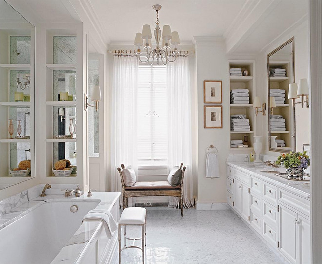 Bathroom. This all-white bathroom has got us wanting to sink into a relaxing bubble bath. Marble surfaces and antique satin vanity benches make this bathroom classic and elegant. Bathroom Shelves. Architectural Digest.