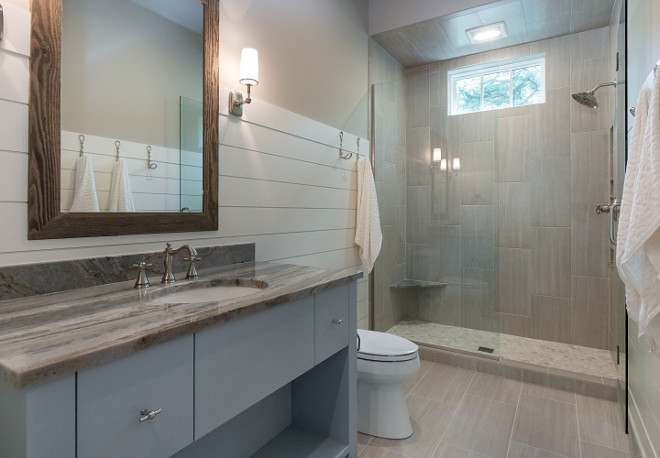 Neutral modern bathroom painted in Revere Pewter by Benjamin Moore on walls and White Dove by Benjamin Moore on Wainscoting. #Bathroom #ReverePewterbyBenjaminMoore #walls #paintcolor #WhiteDovebyBenjaminMoore #Wainscoting 