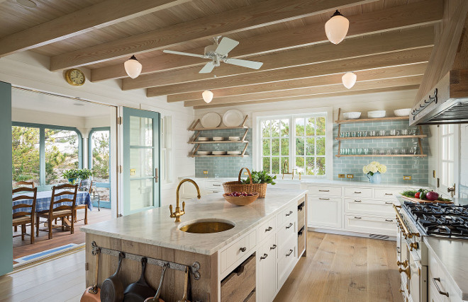 Kitchen. This beach house kitchen is the perfect mix of updated beauty and that classic, beach cottage chic that makes this the kind of place we would want to come back to again and again. #kitchen #beachhousekitchen #kitchens #kitchenideas Dearborn Builders. Interiors by Tory Haynes.