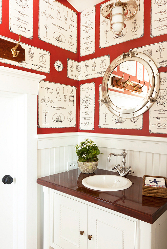 Powder Room. Coastal powder room. Gorgeous coastal powder room with coastal wallpaper and porthole mirror. Coastal with Panache. #powderroom #coastal #Coastalinteirors Designed by Barclay Butera.