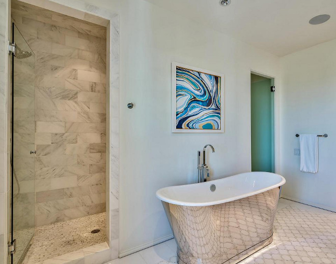 Bathroom shower and flooring tile combination. Flooring is White Thassos Cirlce Pattern with Mosaic Tile and shower tiles are large subway style marble tiles. Interiors by Jan Ware Designs.