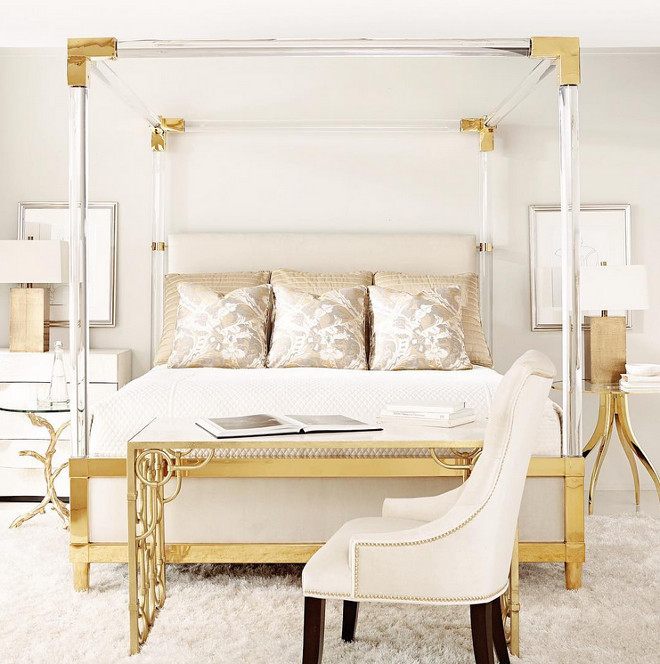 Bedroom with brass accents. Bedroom with brass and lucite canopy bed. Phebe Regency Brass Acrylic Ivory Upholstered Canopy King Bed #Bedrom #brass #lucitebed