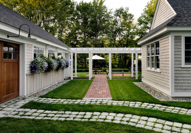 Carriage Garage. Carriage style Garage. Detached Carriage Garage. Landscaping and pathway between house and detached garage. #CarriageGarage #Garage #DetachedGarage Bowley Builders