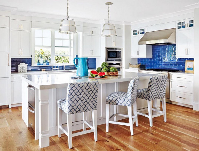 Crisp white kitchen with blue tile backsplash. Beautiful Crisp white kitchen with blue tile backsplash. #Crispwhitekitchen #bluetile #backsplash Jackie Armour Interiors