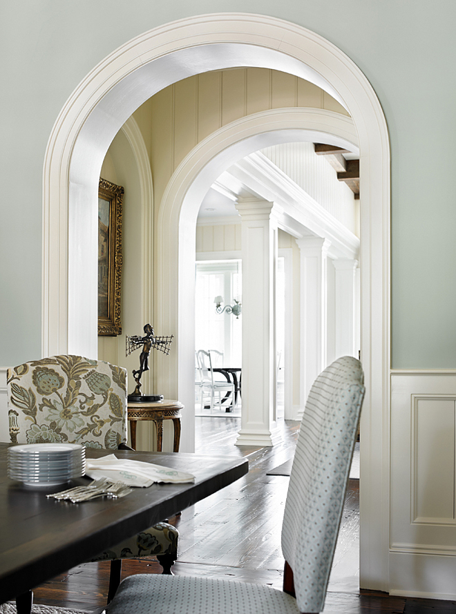 Dining room millwork. Dining room features wall wainscoting, archway with wall paneling and large trims and moldings. Dining room millwork #Diningroom #millwork #wallpaneling #trim #molding #archway #arch T.S. Adams Studio. Interiors by Mary McWilliams from Mary Mac & Co.