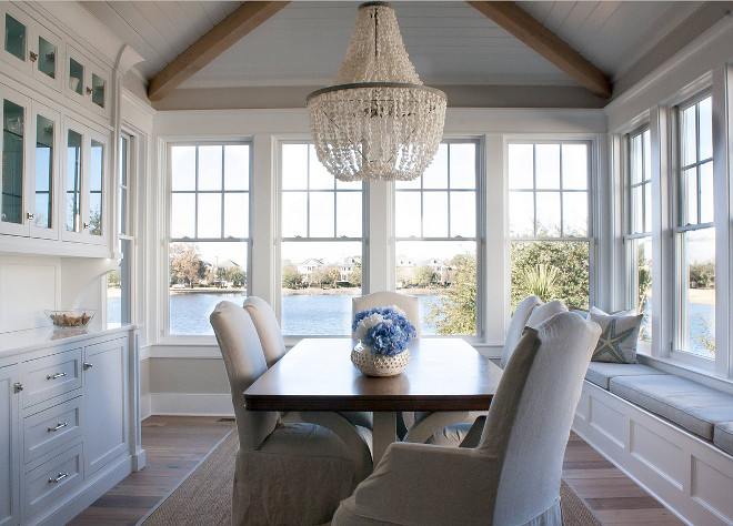 Dining room. Beautiful dining room with window seat, built in buffet cabinet and vaulted ceiling with exposed wood beams & tongue and groove paneling. The Guest House Studio