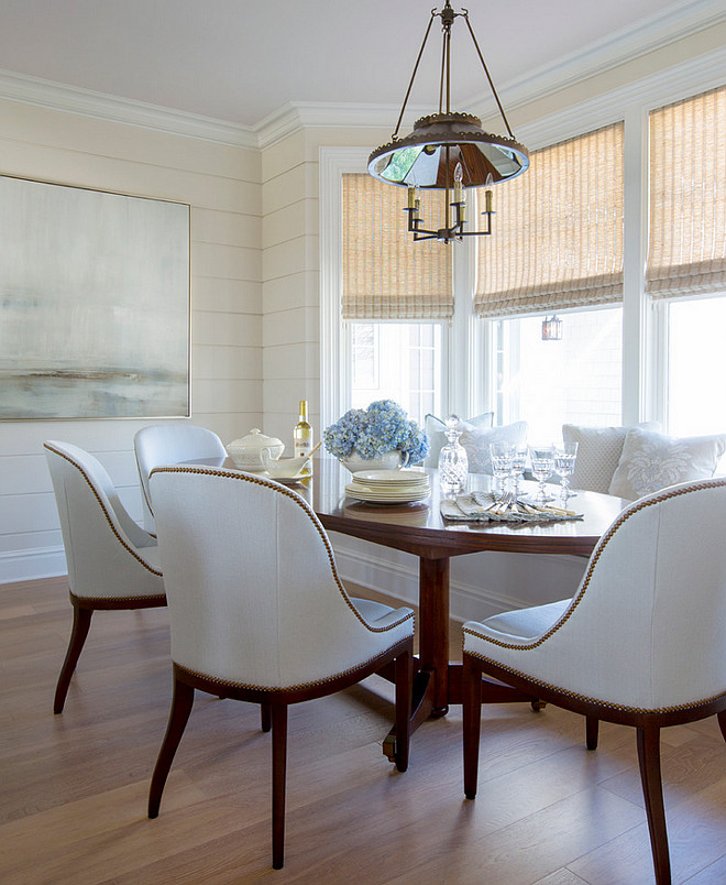 Elegant Breakfast nook with banquette and beautiful white dining chairs. #Breakfastnook #banquette #whitediningchairs Phoebe Howard. Jessie Preza Photography.