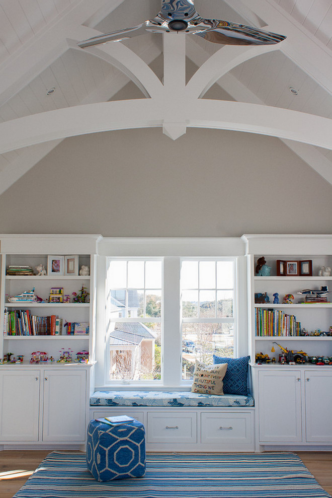 Playroom with vaulted ceiling arched beams. Neutral playroom with vaulted ceiling arched beams and window seat. #Neutralplayroom #Playroom #vaultedceiling #archedbeams #windowseat